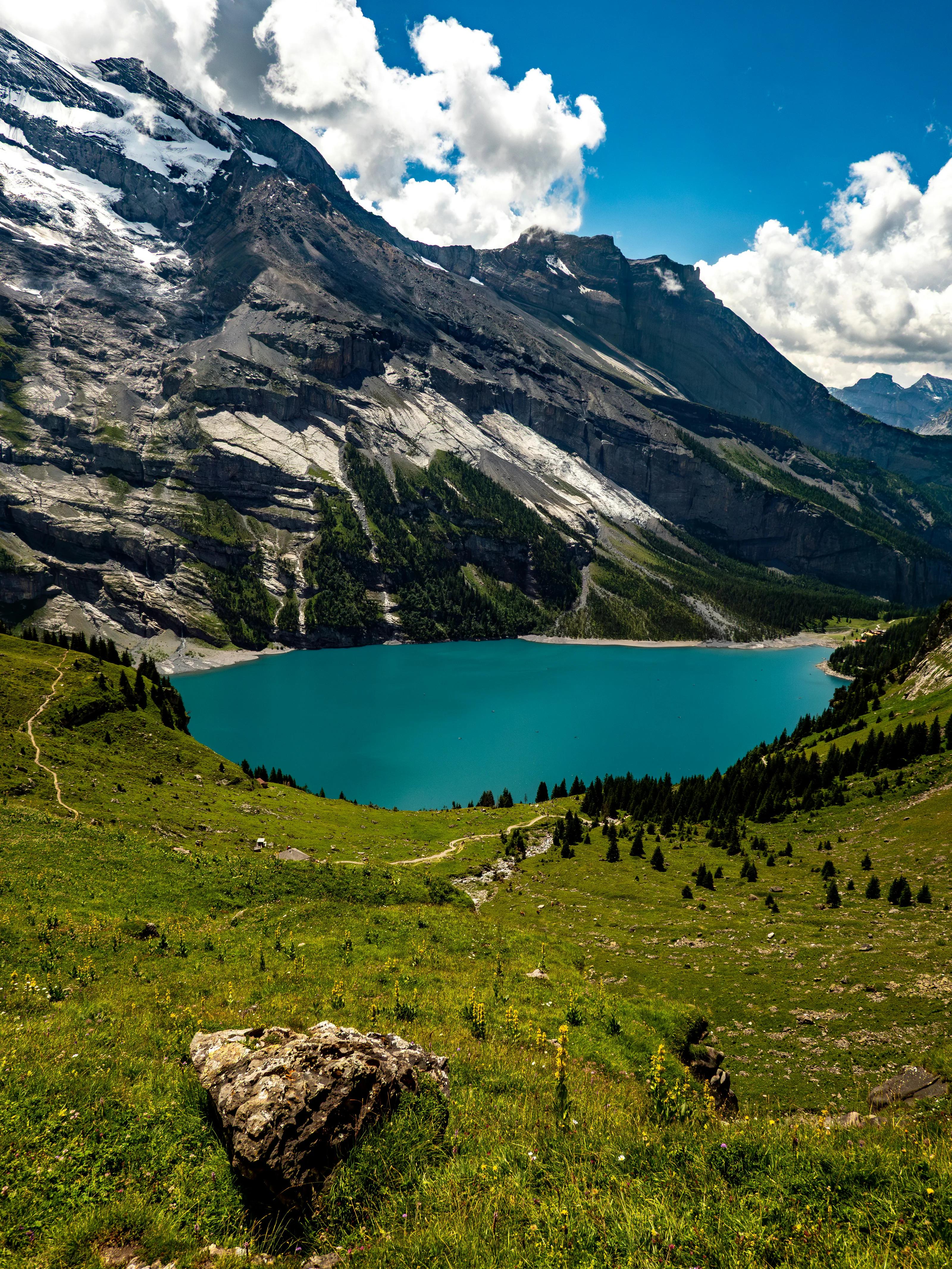 A turquoise lake cradled between Alpine mountains